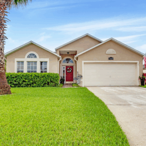 A house with grass and trees in front of it